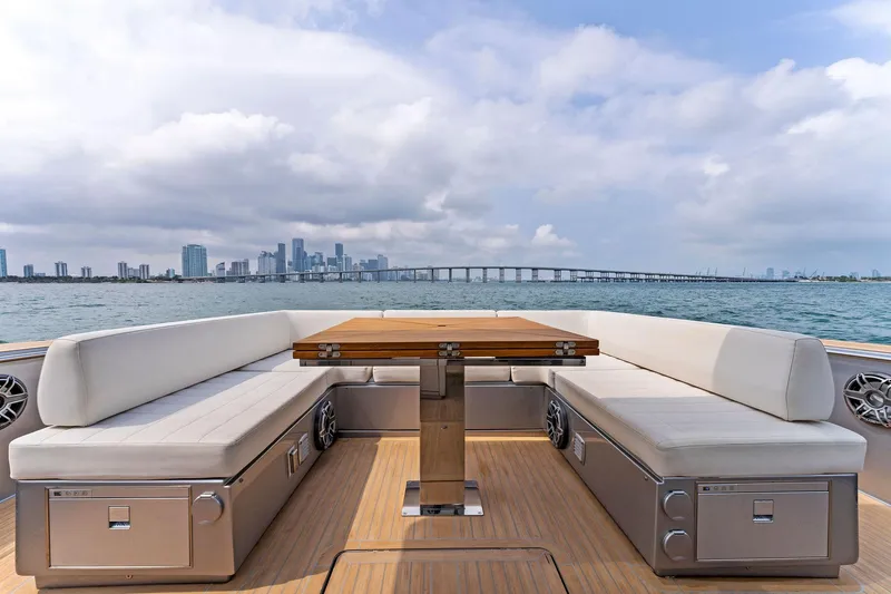 Slide: The Image of Luxury seating area on the 2023 Pardo Yachts 50 with city skyline and bridge view. - 39