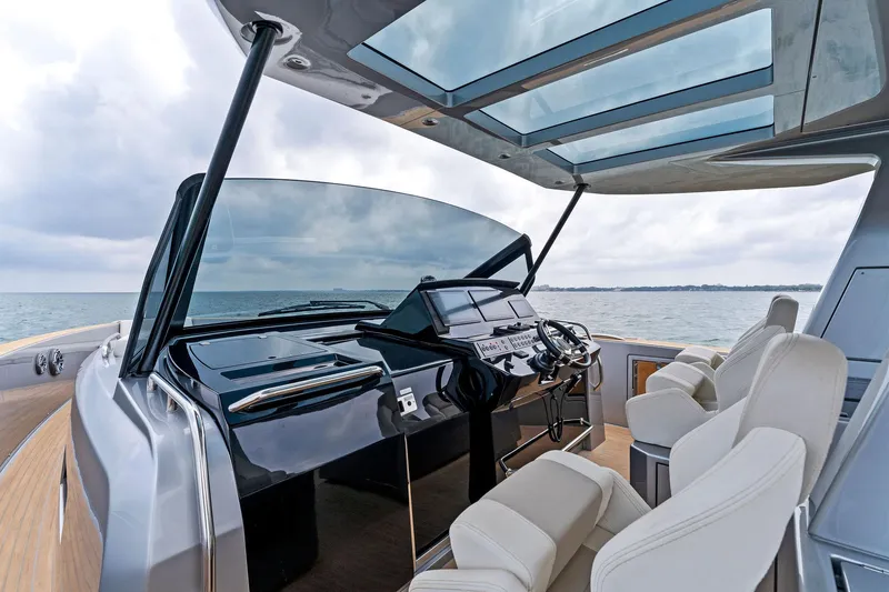 Slide: The Image of 2023 Pardo Yachts 50 helm station with panoramic sea view and luxurious seating. - 47