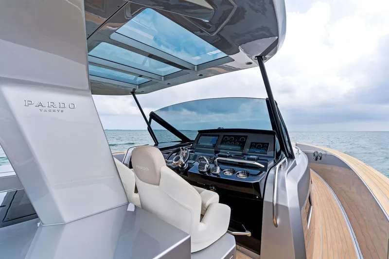 Slide: The Image of 2023 Pardo Yachts 50 model, luxury yacht cockpit with modern navigation system. - 48