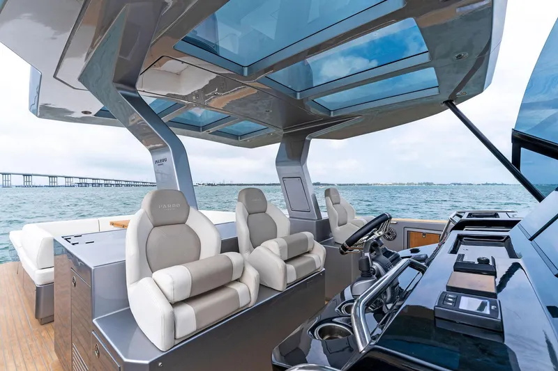 Slide: The Image of Interior view of 2023 Pardo Yachts 50 with luxurious seating and modern helm station. - 49