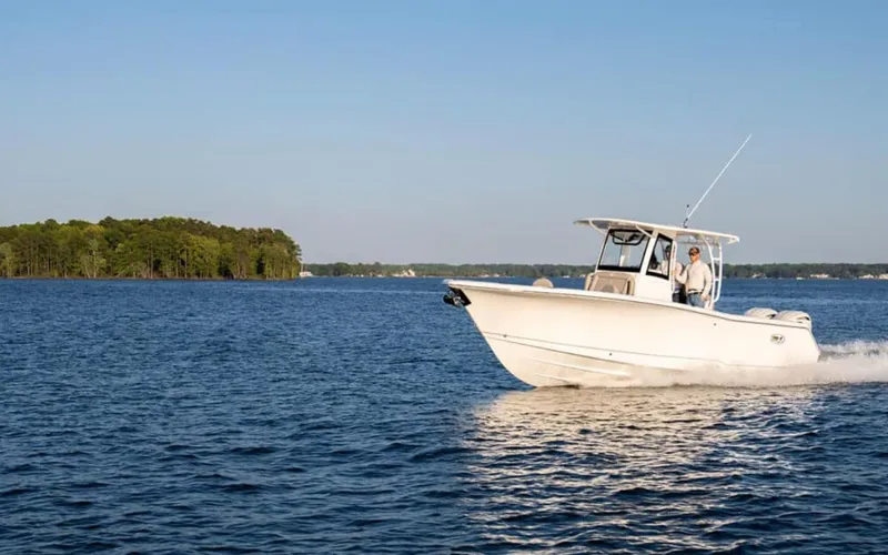 Slide: The Image of 2025 Sea Hunt GAMEFISH 28 cruising on a serene lake. - 6
