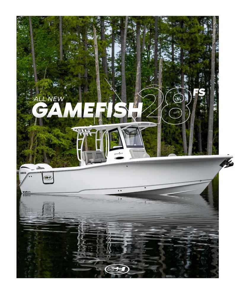 Slide: The Image of 2025 Sea Hunt GAMEFISH 28 boat on calm water with forest background. - 7