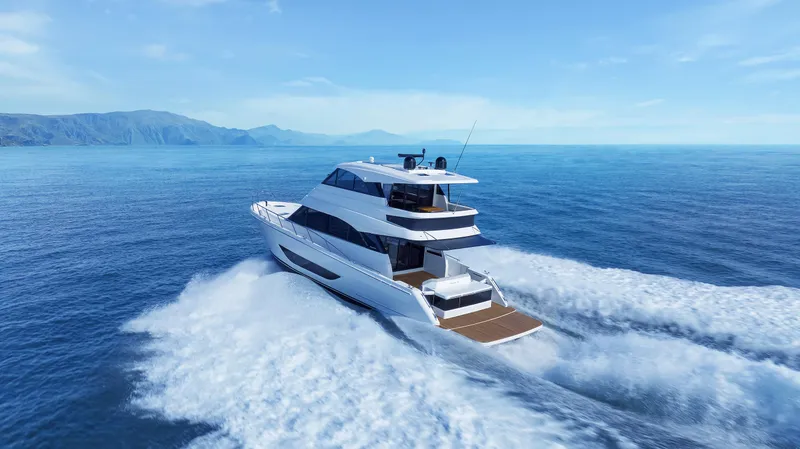 Slide: The Image of 2026 Maritimo M55 yacht cruising on open ocean with scenic mountain backdrop. - 1