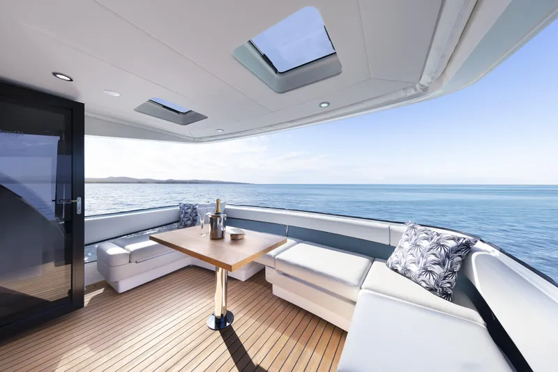 Slide: The Image of Luxurious 2026 Maritimo M55 yacht deck with ocean view and elegant seating area. - 10