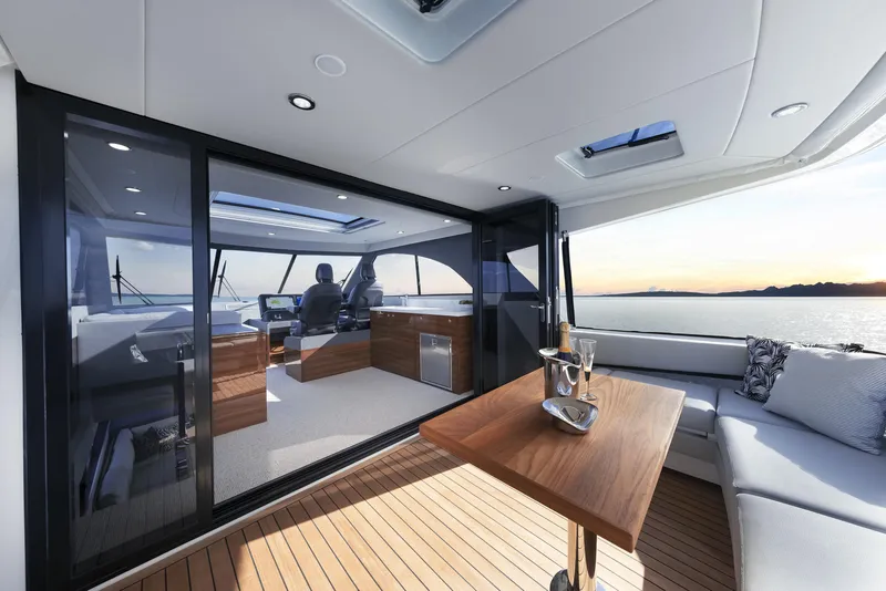 Slide: The Image of Luxurious 2026 Maritimo M55 yacht interior with elegant seating and ocean view. - 11