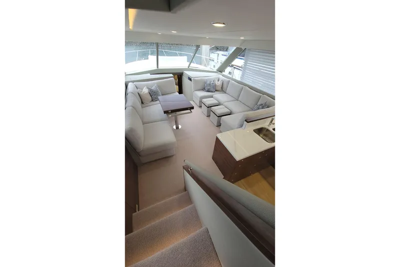 Slide: The Image of Luxurious interior of 2026 Maritimo M55 yacht with plush seating and modern design. - 19
