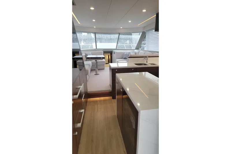 Slide: The Image of Luxurious interior of 2026 Maritimo M55 yacht with modern kitchen and seating area. - 22