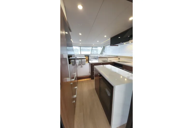 Slide: The Image of Luxurious interior of 2026 Maritimo M55 yacht with modern kitchen and seating area. - 23