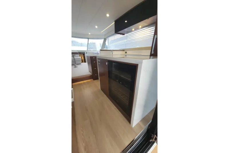 Slide: The Image of Modern interior of 2026 Maritimo M55 yacht with sleek cabinetry and wood flooring. - 24