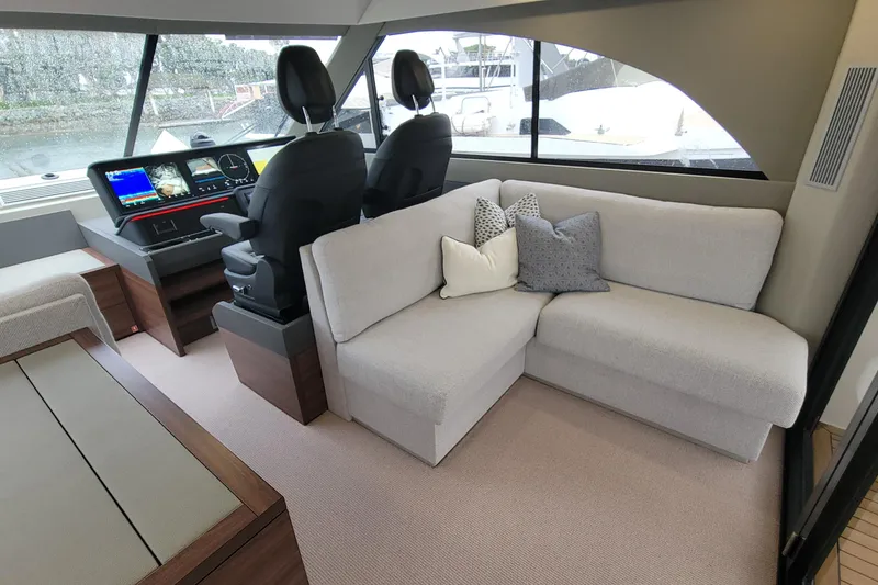 Slide: The Image of Luxurious interior of 2026 Maritimo M55 yacht with helm and cozy seating area. - 30