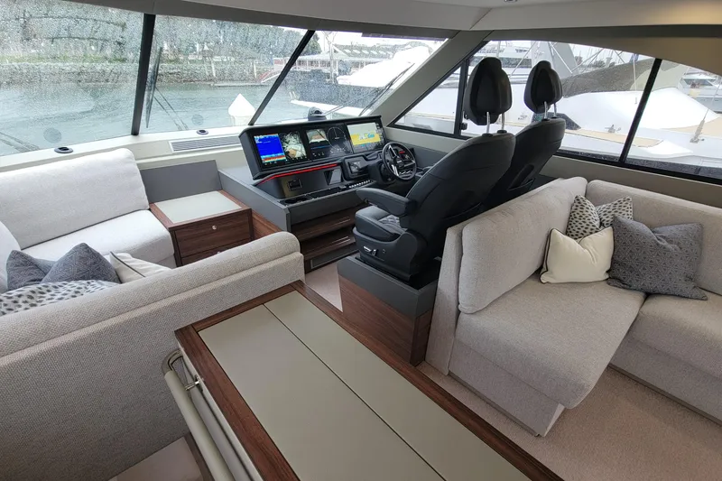 Slide: The Image of Luxurious interior of 2026 Maritimo M55 yacht with modern helm and plush seating. - 31