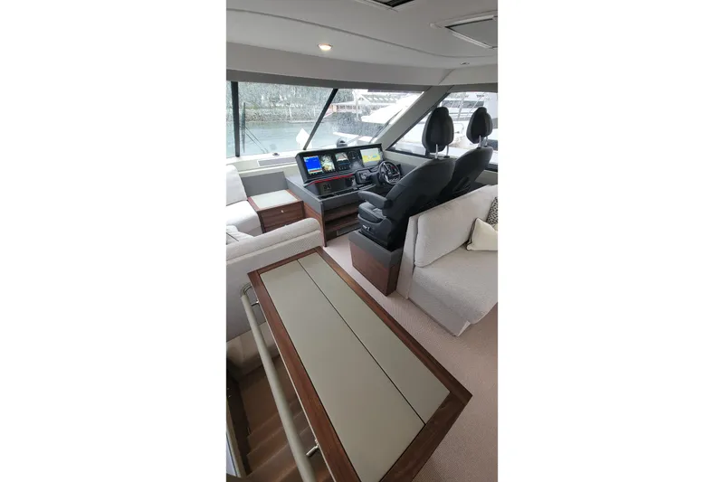 Slide: The Image of Luxurious interior of 2026 Maritimo M55 yacht with modern helm and seating area. - 33