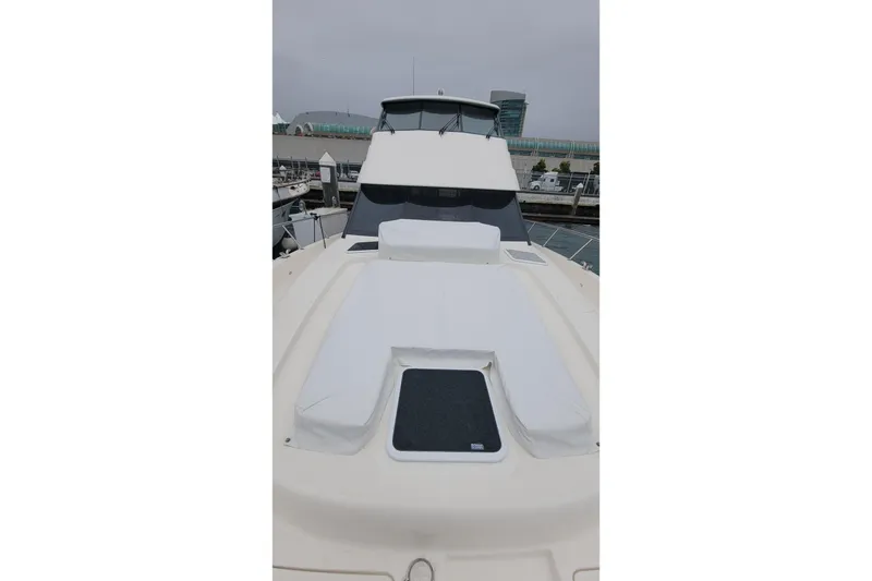 Slide: The Image of 2026 Maritimo M55 yacht with sleek design and spacious deck at marina. - 37