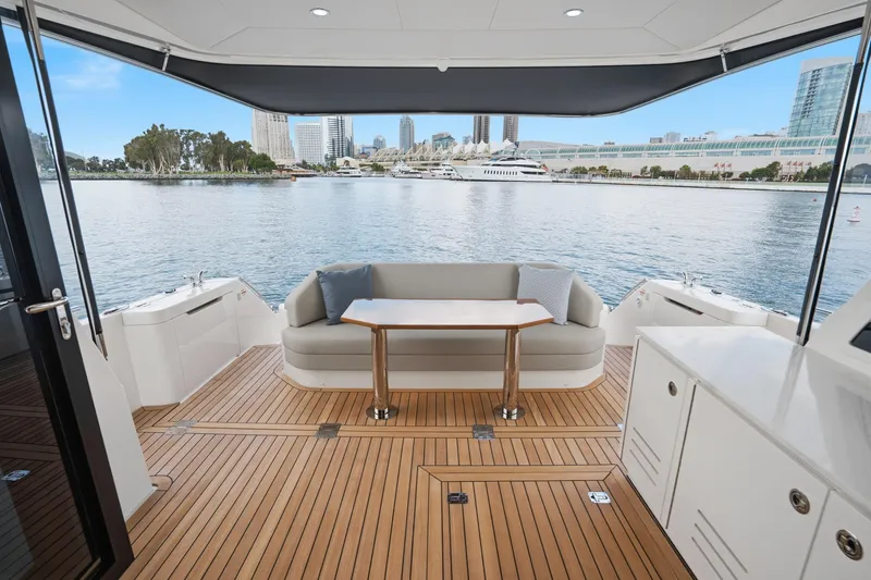 Slide: The Image of Luxurious 2026 Maritimo M55 yacht deck with elegant seating and scenic waterfront view. - 43