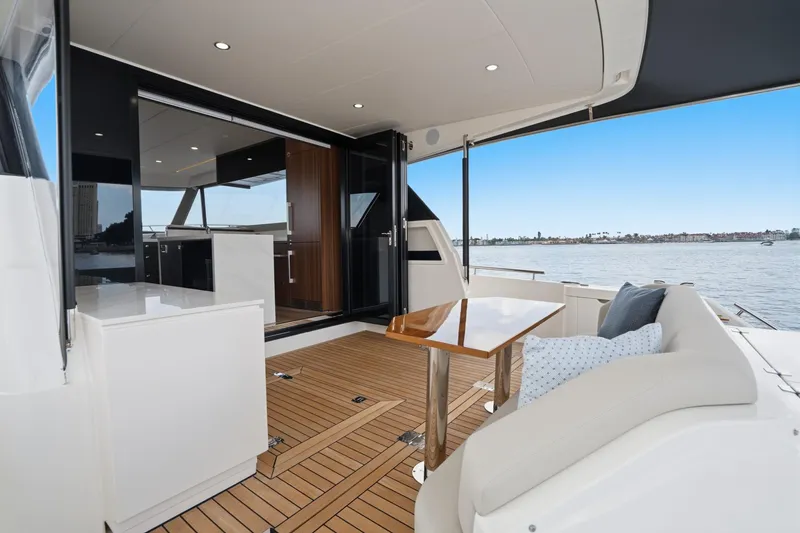 Slide: The Image of Luxurious 2026 Maritimo M55 yacht deck with elegant seating and ocean view. - 44