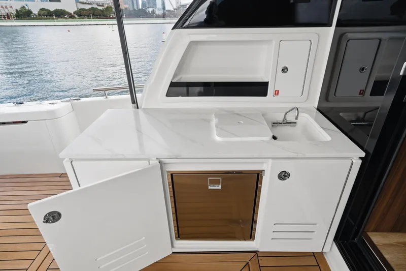 Slide: The Image of Outdoor kitchenette on 2026 Maritimo M55 yacht with sink and storage. - 46