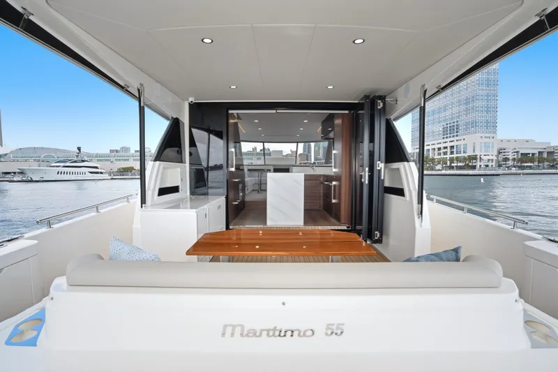 Slide: The Image of 2026 Maritimo M55 yacht interior with waterfront view and modern design. - 47