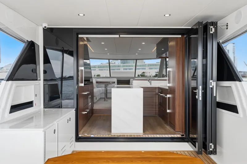 Slide: The Image of Luxurious interior of 2026 Maritimo M55 yacht with modern kitchen and seating area. - 48