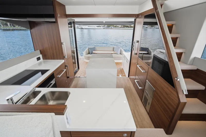 Slide: The Image of Luxurious interior of 2026 Maritimo M55 yacht with modern kitchen and scenic water view. - 50