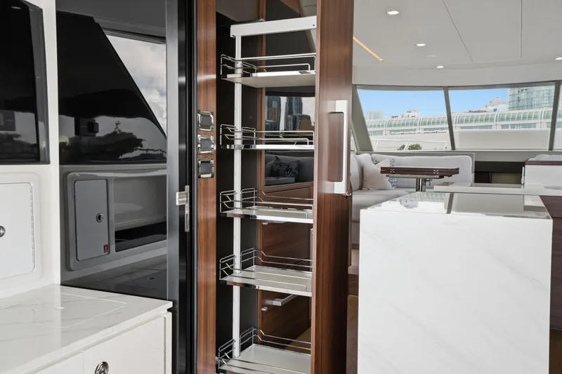 Slide: The Image of Luxurious interior of 2026 Maritimo M55 yacht featuring modern kitchen and sleek design elements. - 53