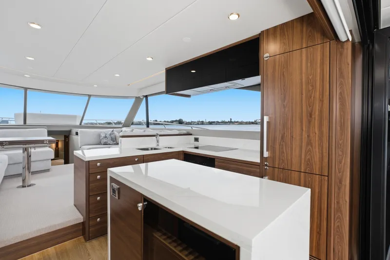 Slide: The Image of Luxurious interior of 2026 Maritimo M55 yacht with modern kitchen and seating area. - 56