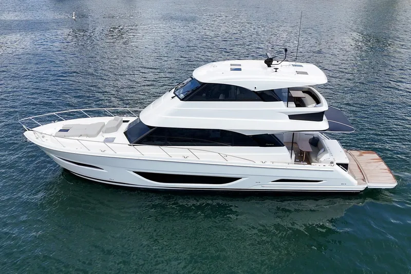 Slide: The Image of 2026 Maritimo M55 luxury yacht cruising on calm waters. - 61