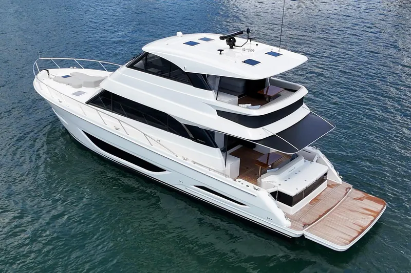 Slide: The Image of 2026 Maritimo M55 luxury yacht on calm water, showcasing sleek design and spacious decks. - 65