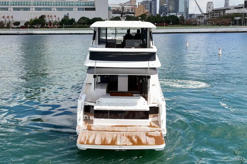 Slide: The Image of Rear view of 2026 Maritimo M55 yacht on water near urban skyline. - 68