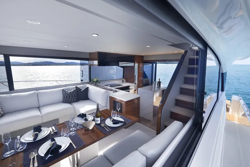 Slide: The Image of Luxurious interior of 2026 Maritimo M55 yacht with elegant dining area and ocean view. - 7