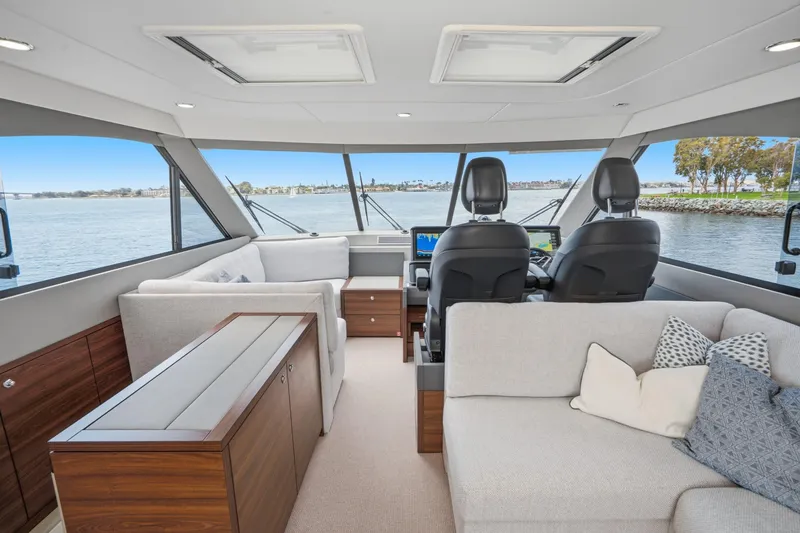 Slide: The Image of Luxurious interior of 2026 Maritimo M55 yacht with modern seating and panoramic windows. - 70