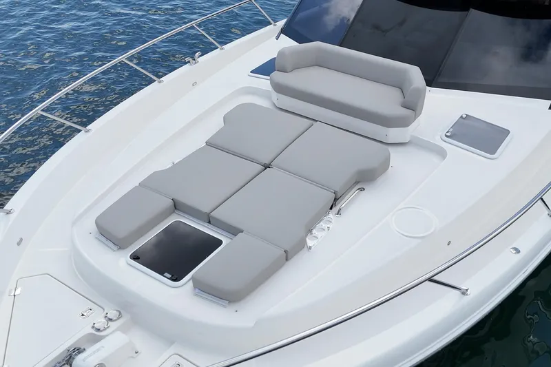 Slide: The Image of 2026 Maritimo M55 yacht with spacious sunbathing deck and cushioned seating. - 73