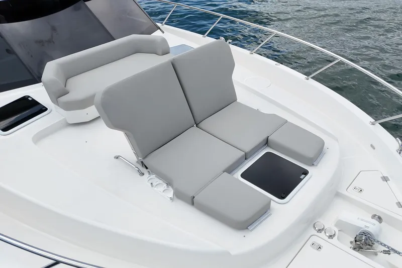 Slide: The Image of Luxury seating on 2026 Maritimo M55 yacht deck, overlooking water. - 75
