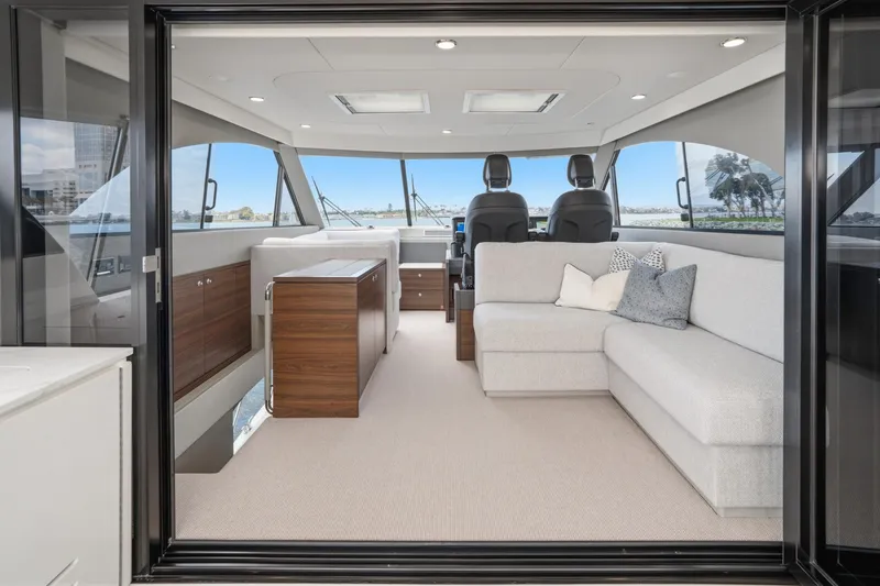 Slide: The Image of Luxurious interior of 2026 Maritimo M55 yacht with modern seating and panoramic windows. - 80