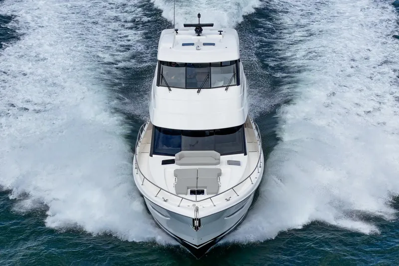 Slide: The Image of 2026 Maritimo M55 yacht cruising on open water, showcasing sleek design and powerful performance. - 82