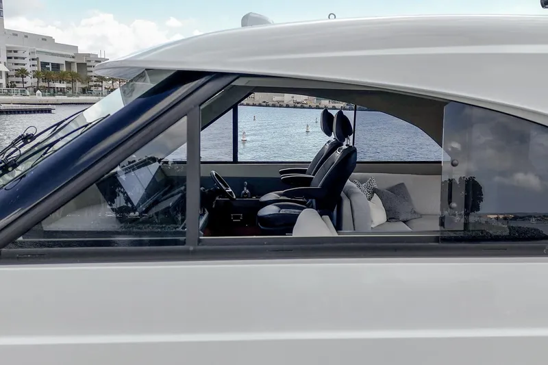 Slide: The Image of Interior view of 2026 Maritimo M55 yacht, showcasing sleek design and waterfront backdrop. - 83