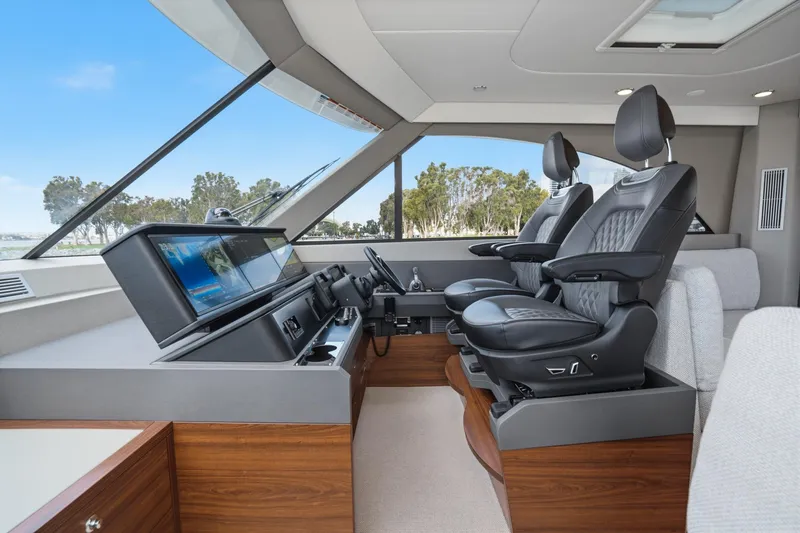 Slide: The Image of Luxurious interior of 2026 Maritimo M55 yacht with modern helm and leather seating. - 84