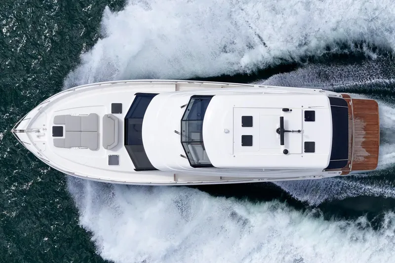 Slide: The Image of Aerial view of 2026 Maritimo M55 yacht cruising through ocean waves. - 85