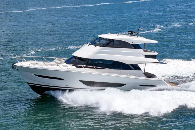 Slide: The Image of 2026 Maritimo M55 yacht cruising on open water, showcasing sleek design and luxury. - 86