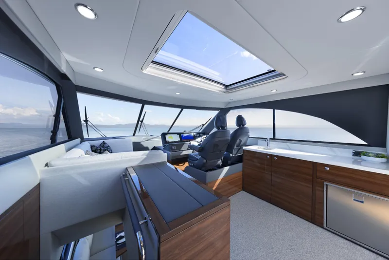 Slide: The Image of Luxurious interior of 2026 Maritimo M55 yacht with panoramic windows and modern furnishings. - 9