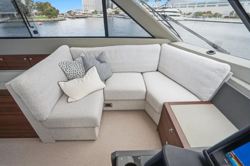 Slide: The Image of Luxurious interior of 2026 Maritimo M55 yacht with plush seating and scenic water view. - 91