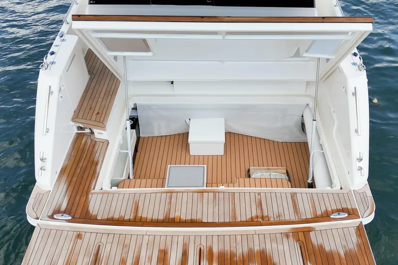 Slide: The Image of 2026 Maritimo M55 yacht with open deck and wooden flooring. - 93