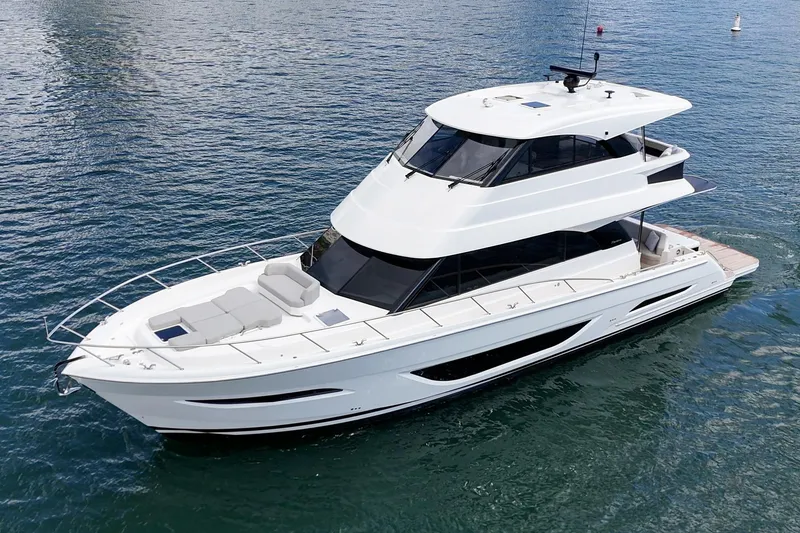 Slide: The Image of 2026 Maritimo M55 yacht cruising on calm blue waters. - 94