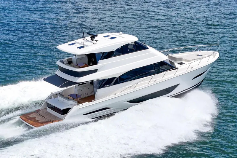 Slide: The Image of 2026 Maritimo M55 yacht cruising on open water, showcasing sleek design and luxury features. - 95