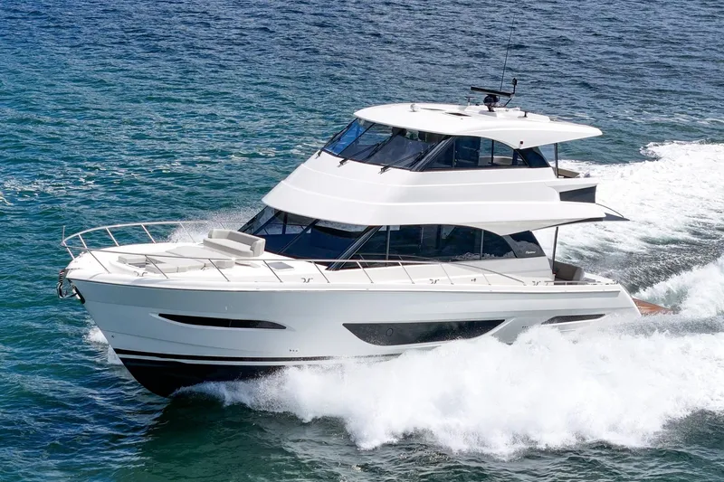 Slide: The Image of 2026 Maritimo M55 yacht cruising on open water, showcasing sleek design and luxury features. - 97