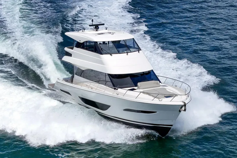 Slide: The Image of 2026 Maritimo M55 yacht cruising on open water, showcasing sleek design and powerful performance. - 98