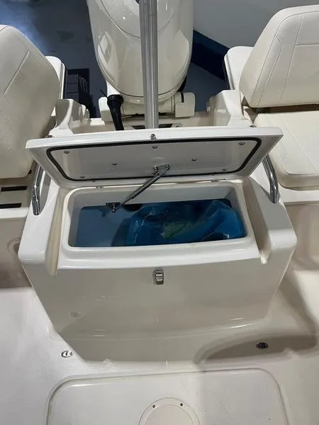 Slide: The Image of 2024 Grady-White Freedom 215 boat interior with open storage compartment. - 10