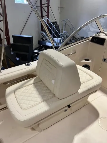 Slide: The Image of 2024 Grady-White Freedom 215 boat interior with cushioned seating. - 11