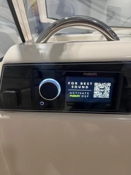 Slide: The Image of 2024 Grady-White Freedom 215 boat audio system with Fusion DSP activation display. - 16