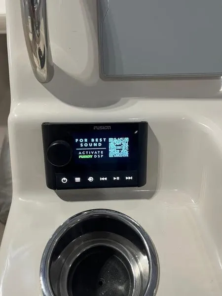 Slide: The Image of 2024 Grady-White Freedom 215 boat audio system with Fusion display and controls. - 17