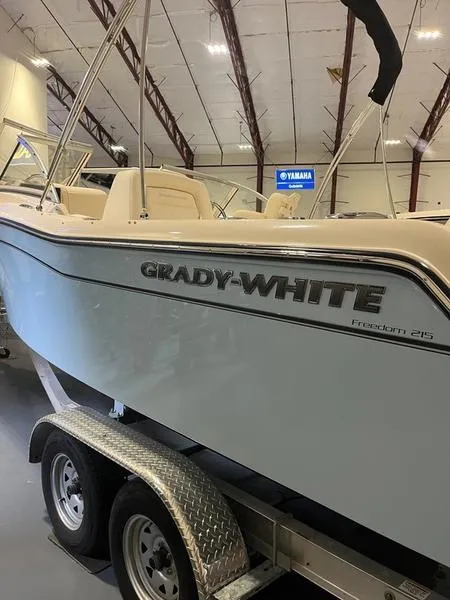 Slide: The Image of 2024 Grady-White Freedom 215 boat on trailer in showroom. - 3